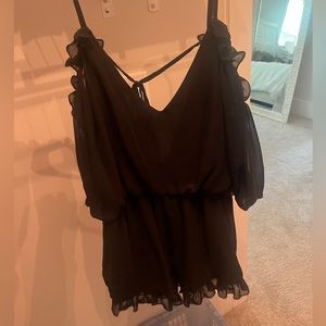 Black off the shoulder romper. Ruffled details size medium